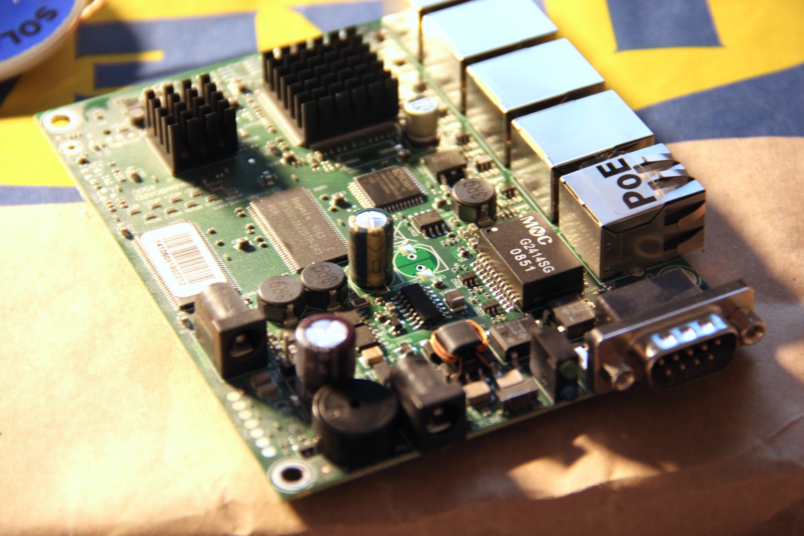 RouterBoard 450G without case, one capacitor desoldered.